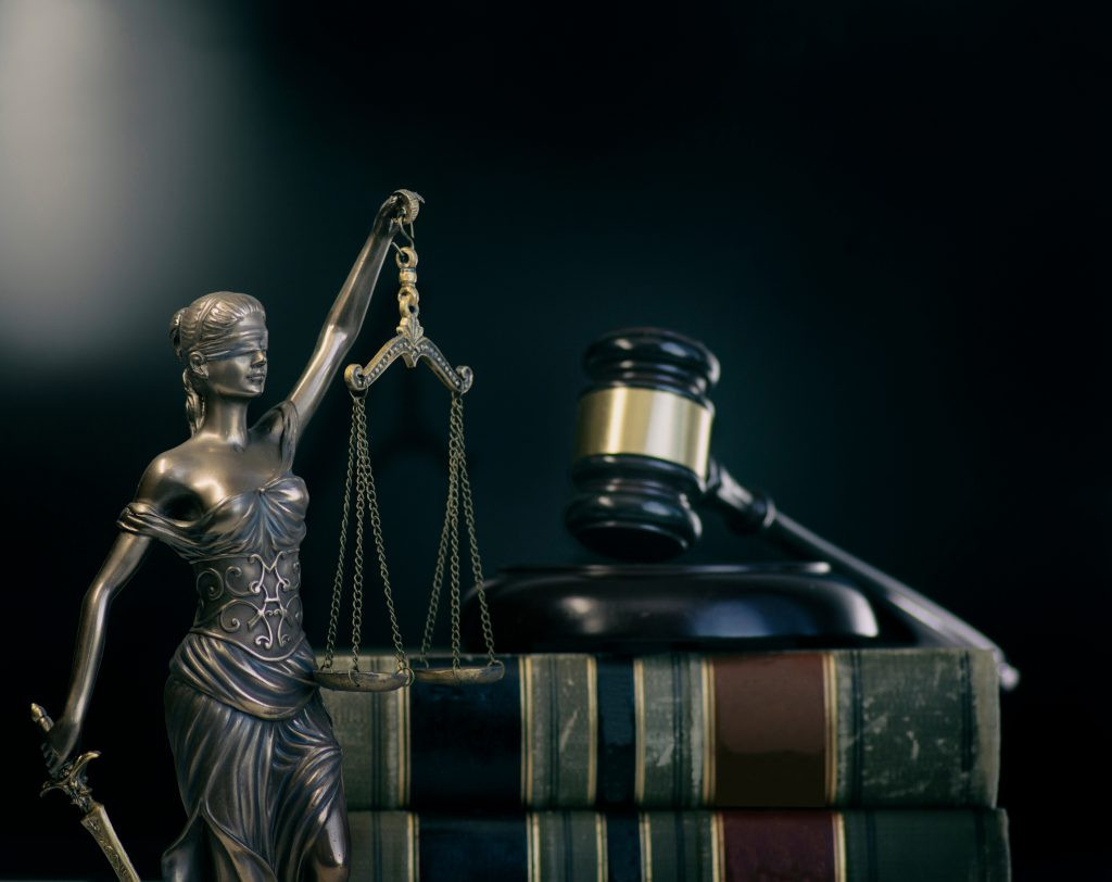 Scales of justice symbolizing fairness and the balance between prosecution and defense in the legal system.