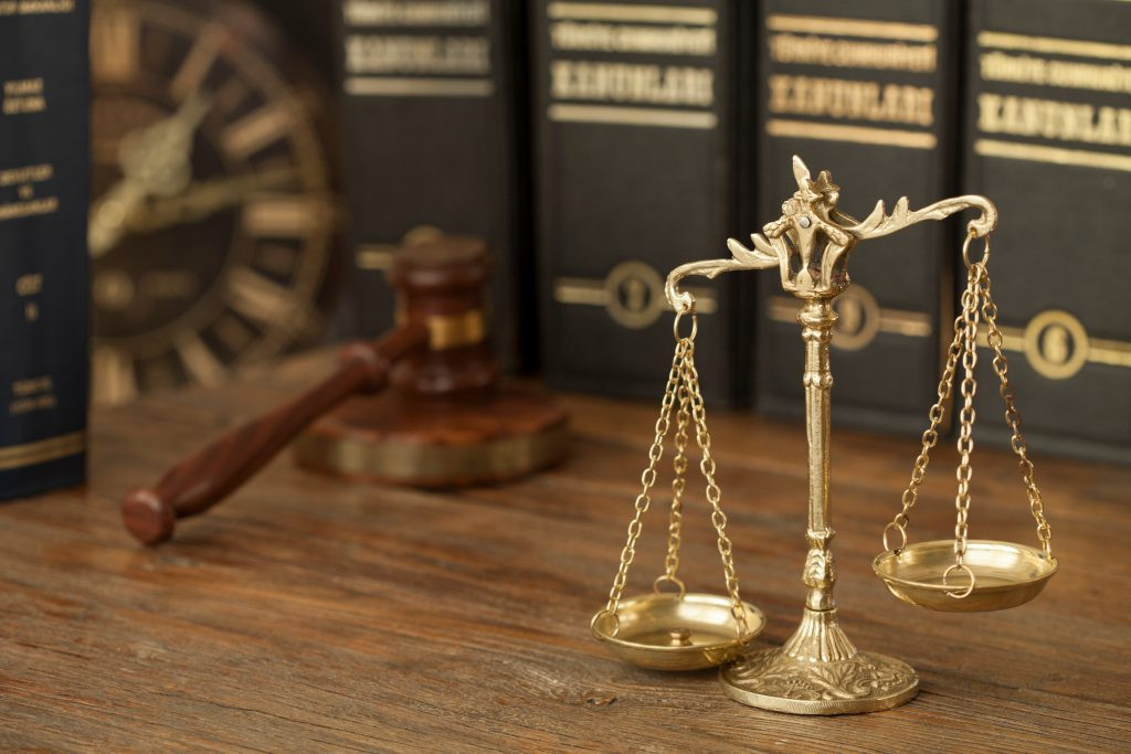 Lawyers in a busy office environment, representing the demanding workload of legal professionals.