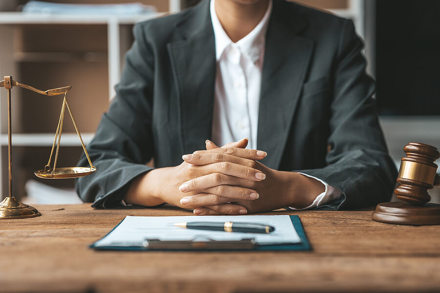 A lawyer in a courtroom setting, symbolizing the profession of criminal defense attorneys and their work environment.