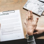 two paralegal professionals going over a contract