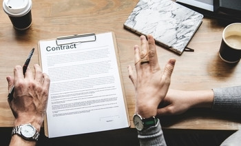 two paralegal professionals going over a contract