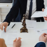 Couple consulting with a divorce attorney about legal fees