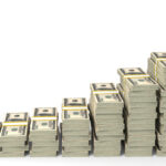 Stack of money representing lawyer income trends and financial analysis.
