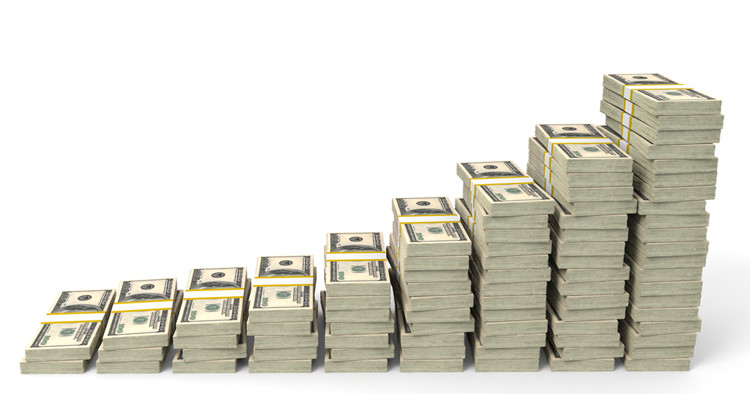 Stack of money representing lawyer income trends and financial analysis.