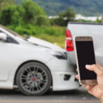 Woman making a call after car accident, contacting a car accident lawyer in NJ