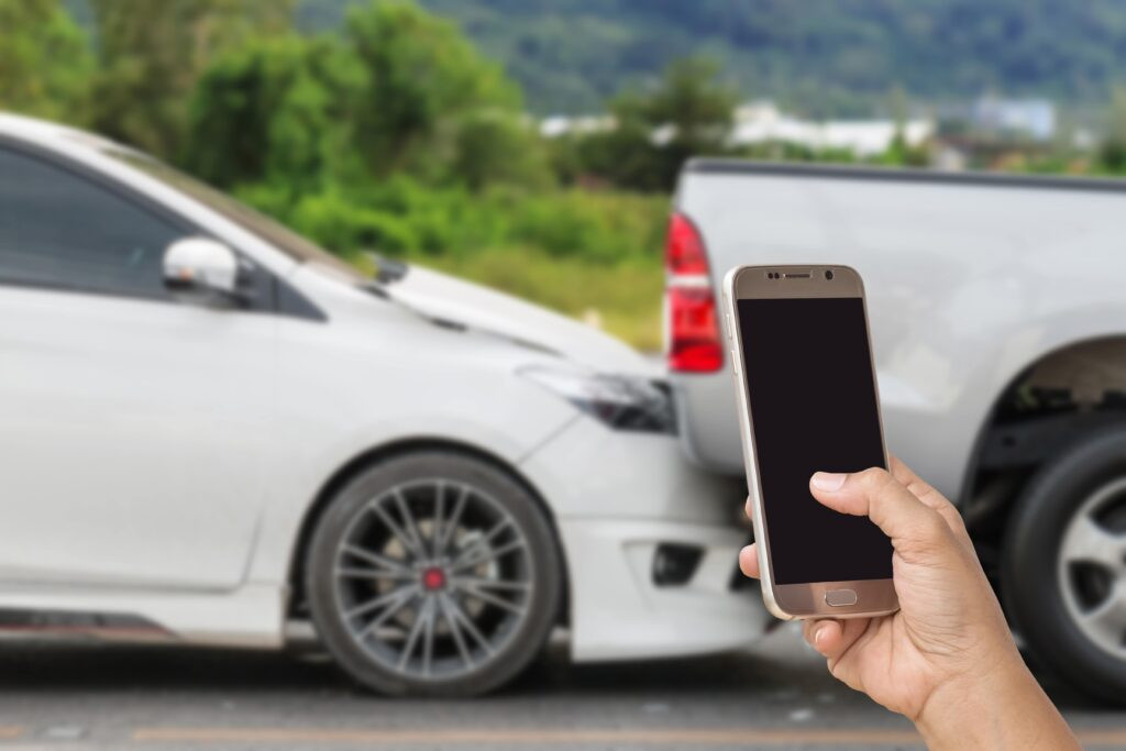 Woman making a call after car accident, contacting a car accident lawyer in NJ