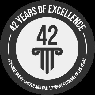 Badge highlighting 42 years of experience in legal practice