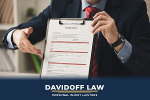 Lawyer on phone negotiating with insurance company, representing insurance dealings