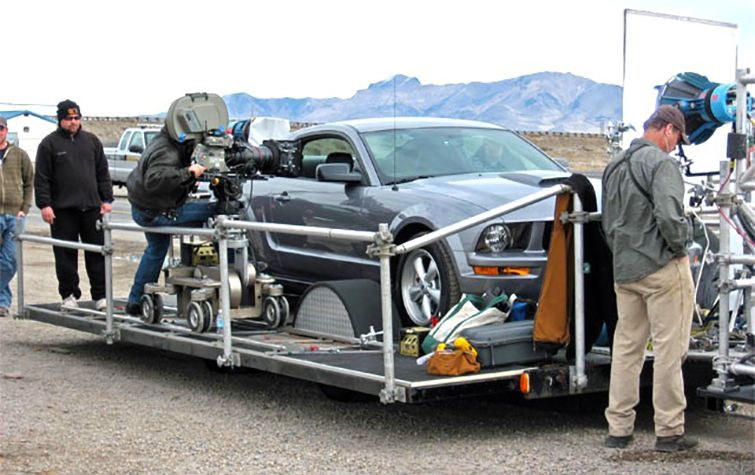 Behind the scenes shot of filming car driving scenes for The Lincoln Lawyer using a process trailer