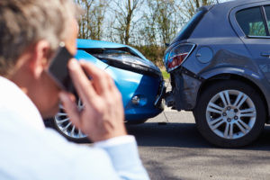 Woman talking on the phone after car accident in Lafayette, Louisiana