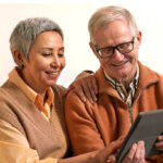 Mature couple holding a tablet