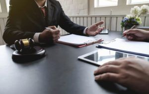 Houston car crash lawyer explaining legal options to a client after a car accident in Houston.