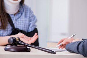 A car accident victim consulting with a car wreck lawyer in Louisville about her case options.