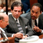 Robert Kardashian, O.J. Simpson, and Alvin Michaelson during a hearing in the O.J. Simpson trial, highlighting Kardashian's role as Simpson's lawyer and father figure amidst the legal drama.