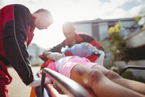 Person on stretcher after auto accident
