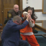 Taylor Schabusiness attacks her attorney, Quinn Jolly, in Brown County court in Green Bay, Wis., on Tuesday, Feb. 14, 2023