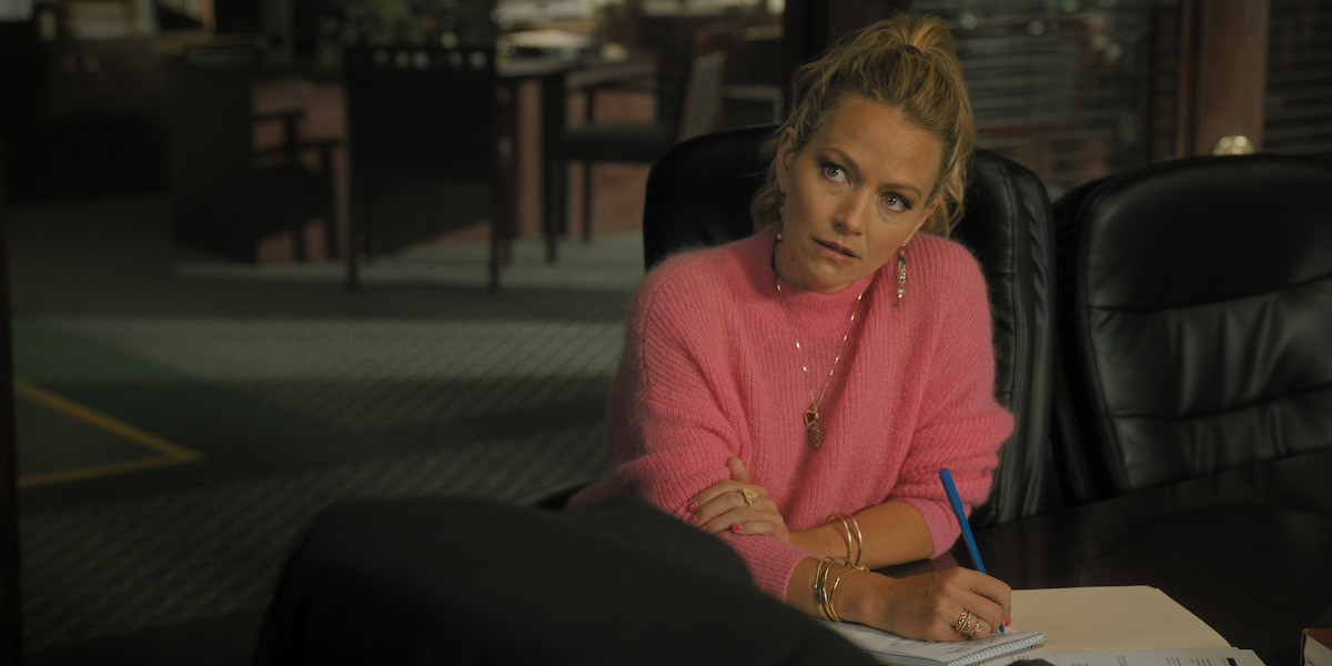 Becki Newton as Lorna Crane in ‘The Lincoln Lawyer’ Season 2, wearing a pink sweater