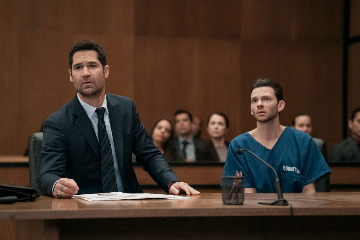 Still from The Lincoln Lawyer showcasing Andy Freemann in a tense courtroom scene, emphasizing her role in uncovering corruption and seeking legal accountability.