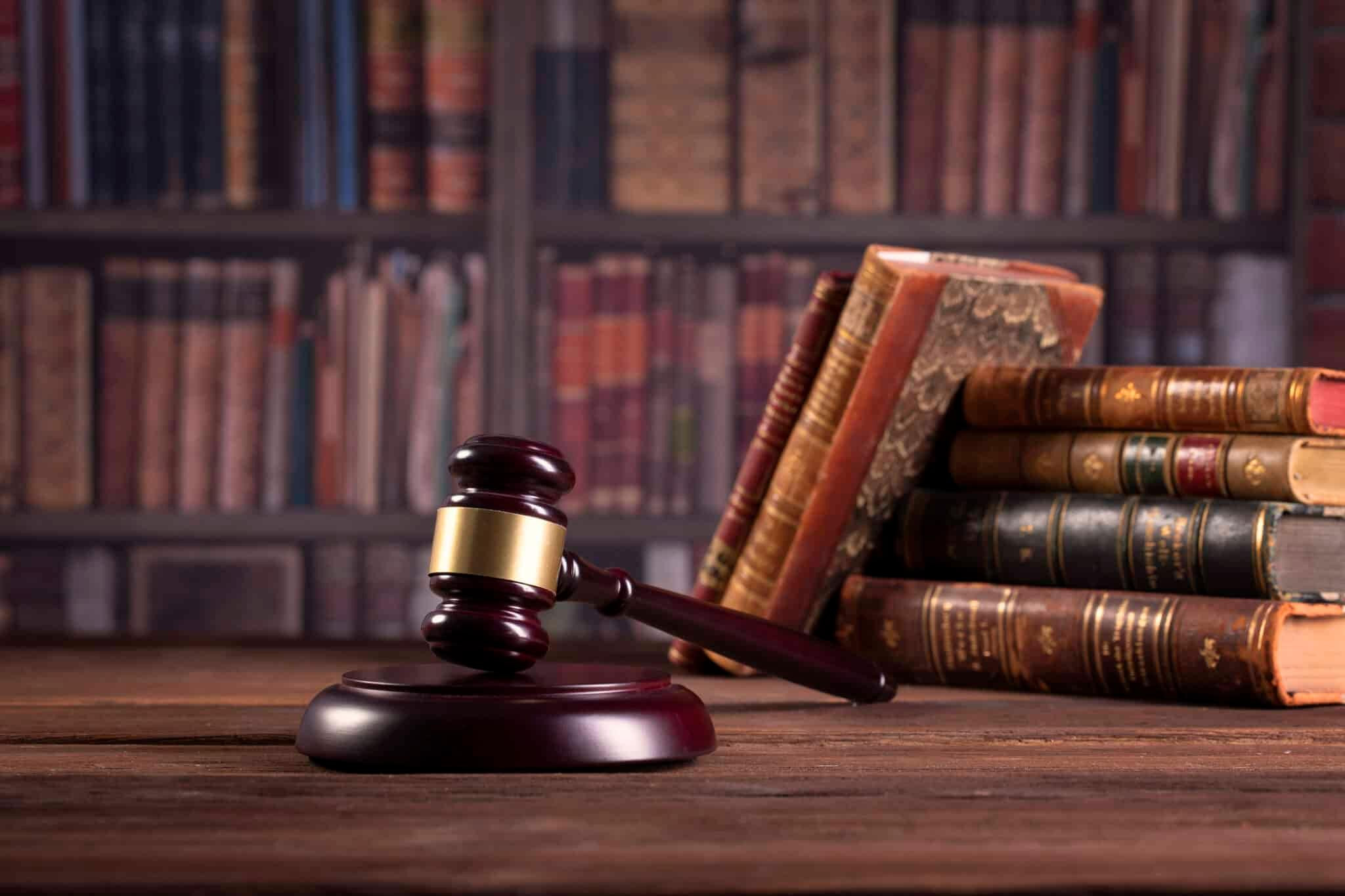 Close-up of a lawyer using a laptop at a modern law firm, displaying client intake lead management features.