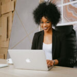 Person sitting at desk with laptop