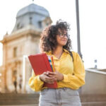 Student walking with books at university